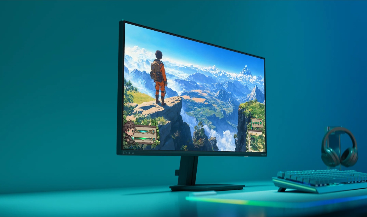 Monitor gamer Philips Evnia 27M2N3200NF57 em setup gamer completo com teclado e fone, exibindo paisagem de montanhas na tela Full HD IPS
