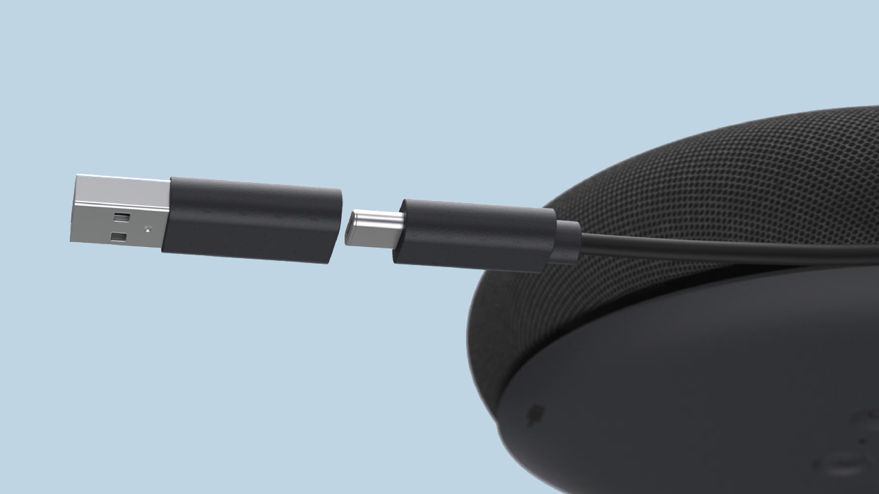 Close-up do cabo USB-C com adaptador USB-A e canal de organização do Dell Pro Plus SL525