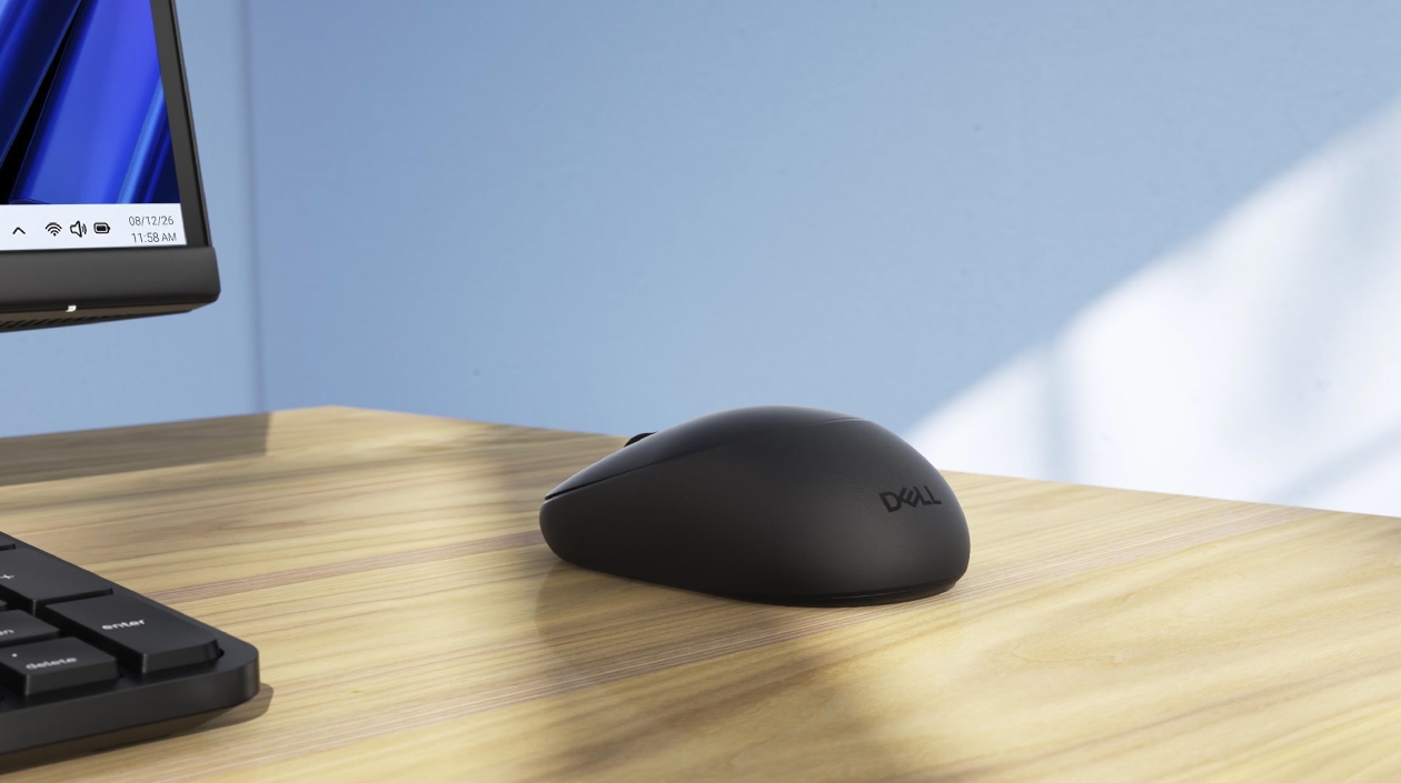 Mouse Dell Pro KM526 em perspectiva de perfil sobre mesa de madeira com design minimalista